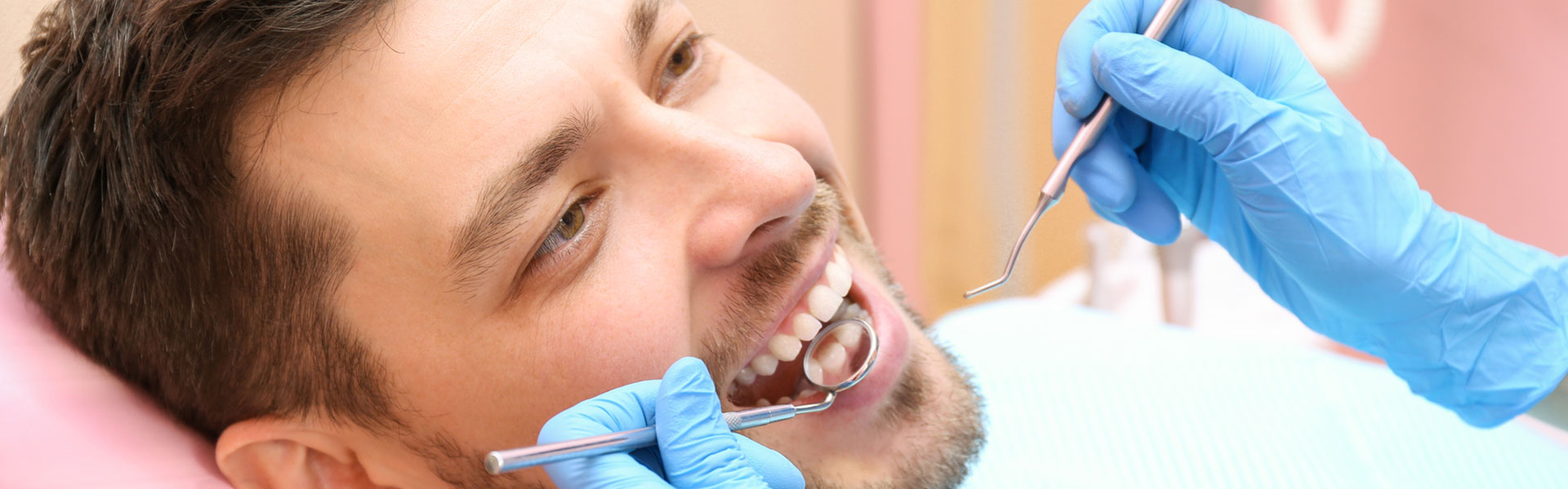 A man smiling at the dental